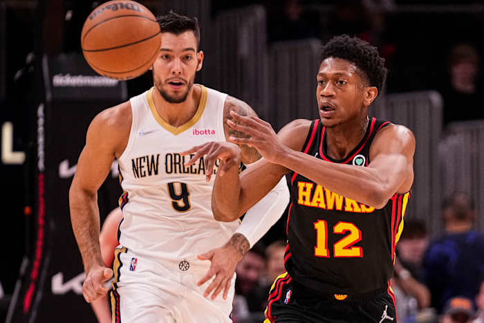 De'Andre Hunter passes the ball up the court.